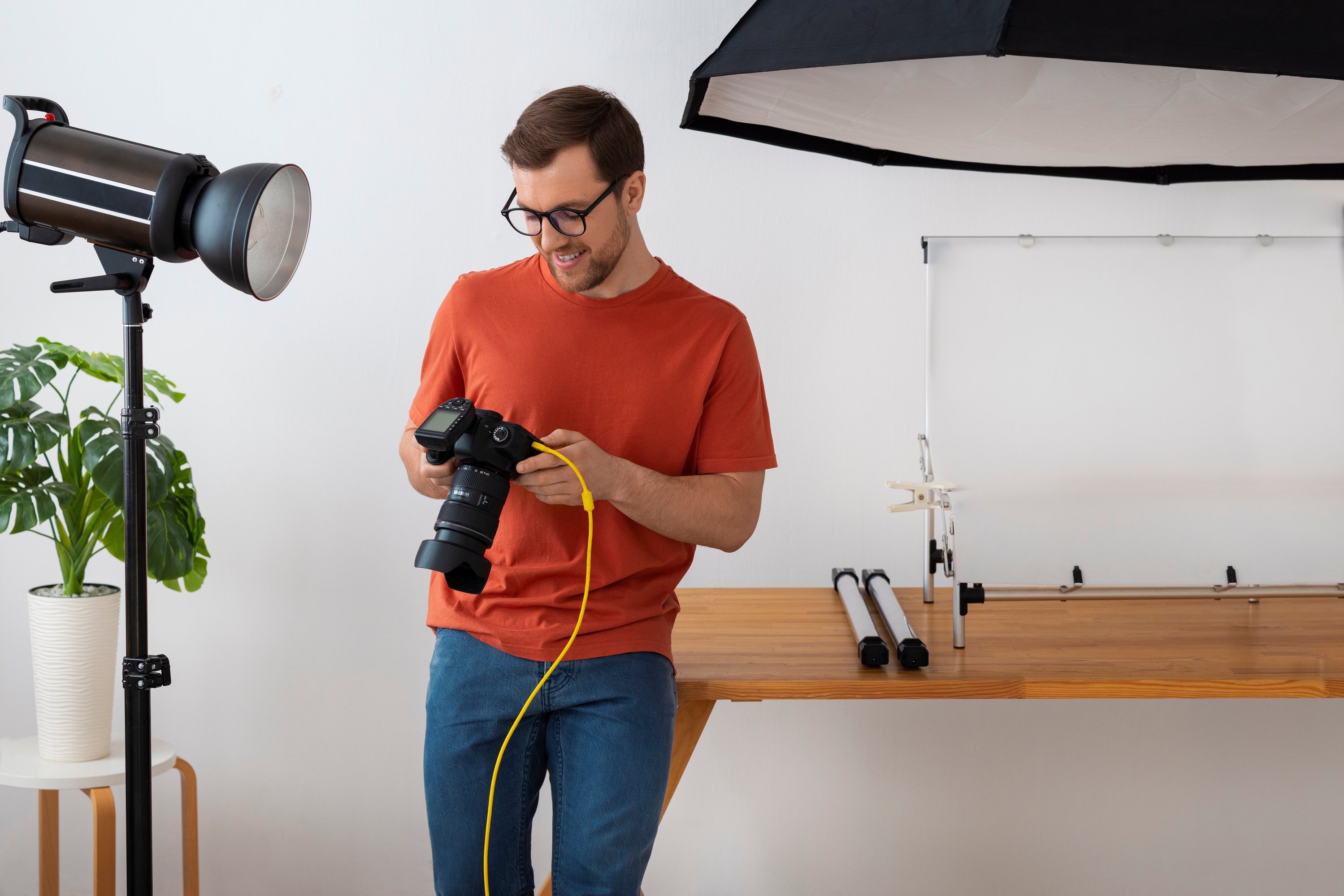 Woman holding camera over a food table setup