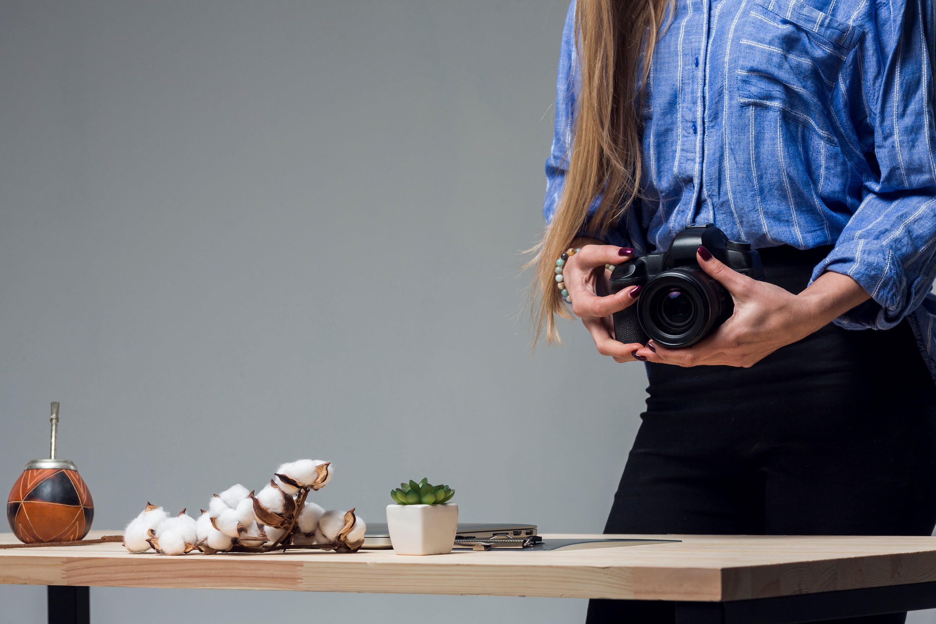 Woman reviewing food photography shots on her camera